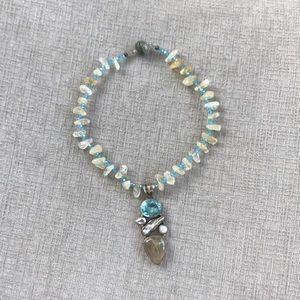 One of a kind crystal & blue topaz necklace.